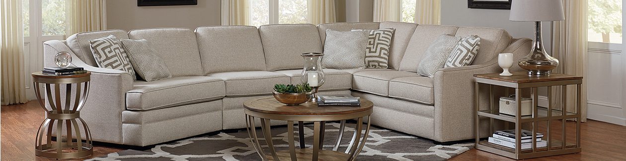 Tennessee Custom Upholstery fabric sectional sofa in a light colored fabric.