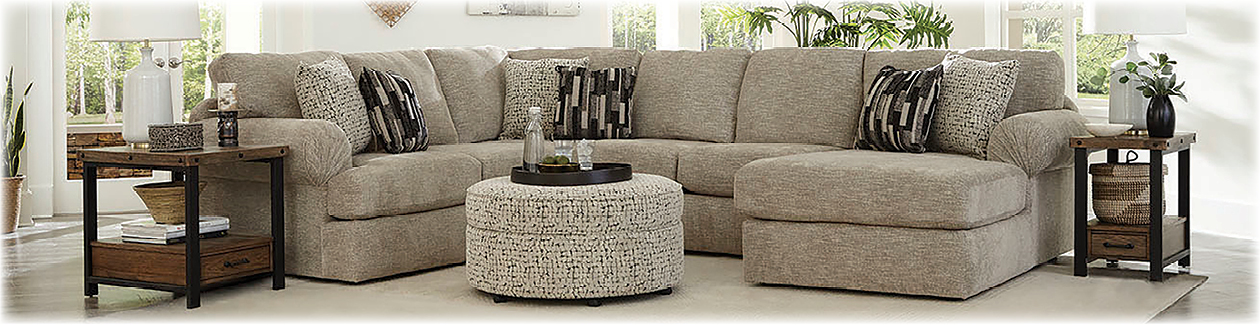 Tennessee Custom Upholstery fabric sectional sofa in a light colored fabric.